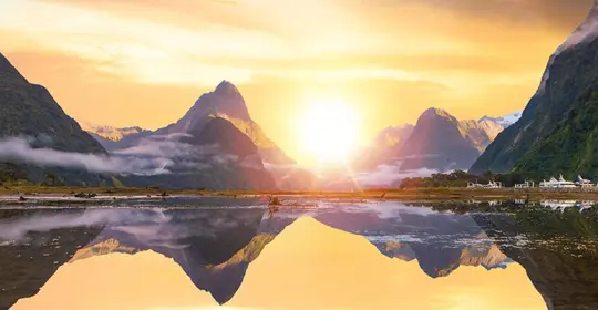 Sun rising over Milford Sound, New Zealand
